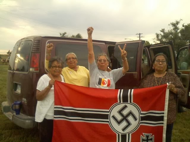Lakota women with captured neo Nazi flag