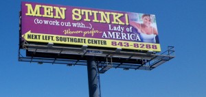 a billboard reading "men stink"