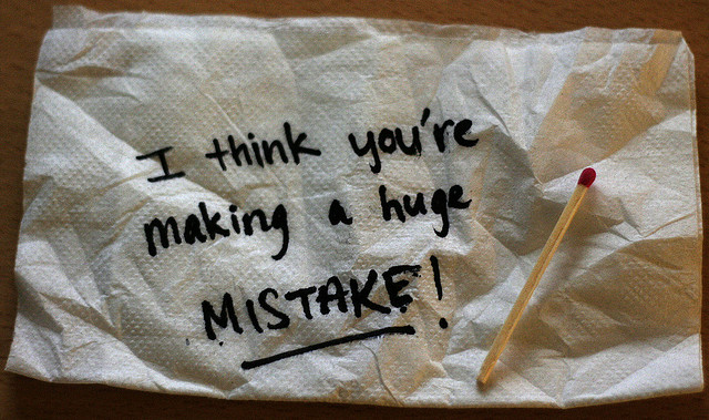 Napkin reading "I think you're making a huge MISTAKE!" along with a match