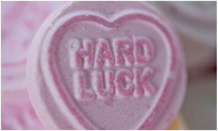 Valentine's candy heart with words "hard luck"