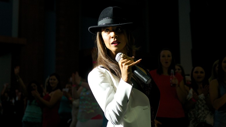 Jada Pinkett Smith in Magic Mike XXL with white suit and fedora, MCing like a boss