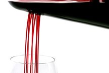 Wine pours from a decanter with three holes for a waterfall effect