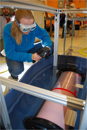 Female scientist testing equipment
