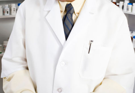 A man's torso in a white lab coat