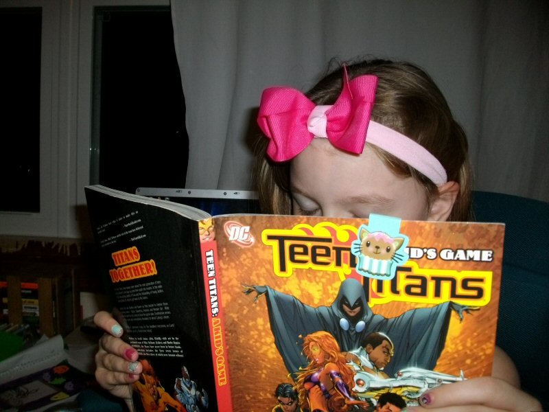 Girl reading a comic book