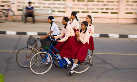 Group of Indian schoolgirls on bicycles